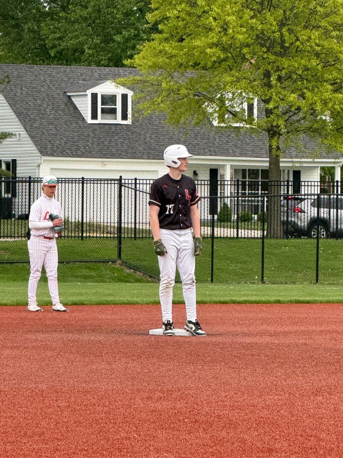 Connor Schneider standing on base for Lutheran West